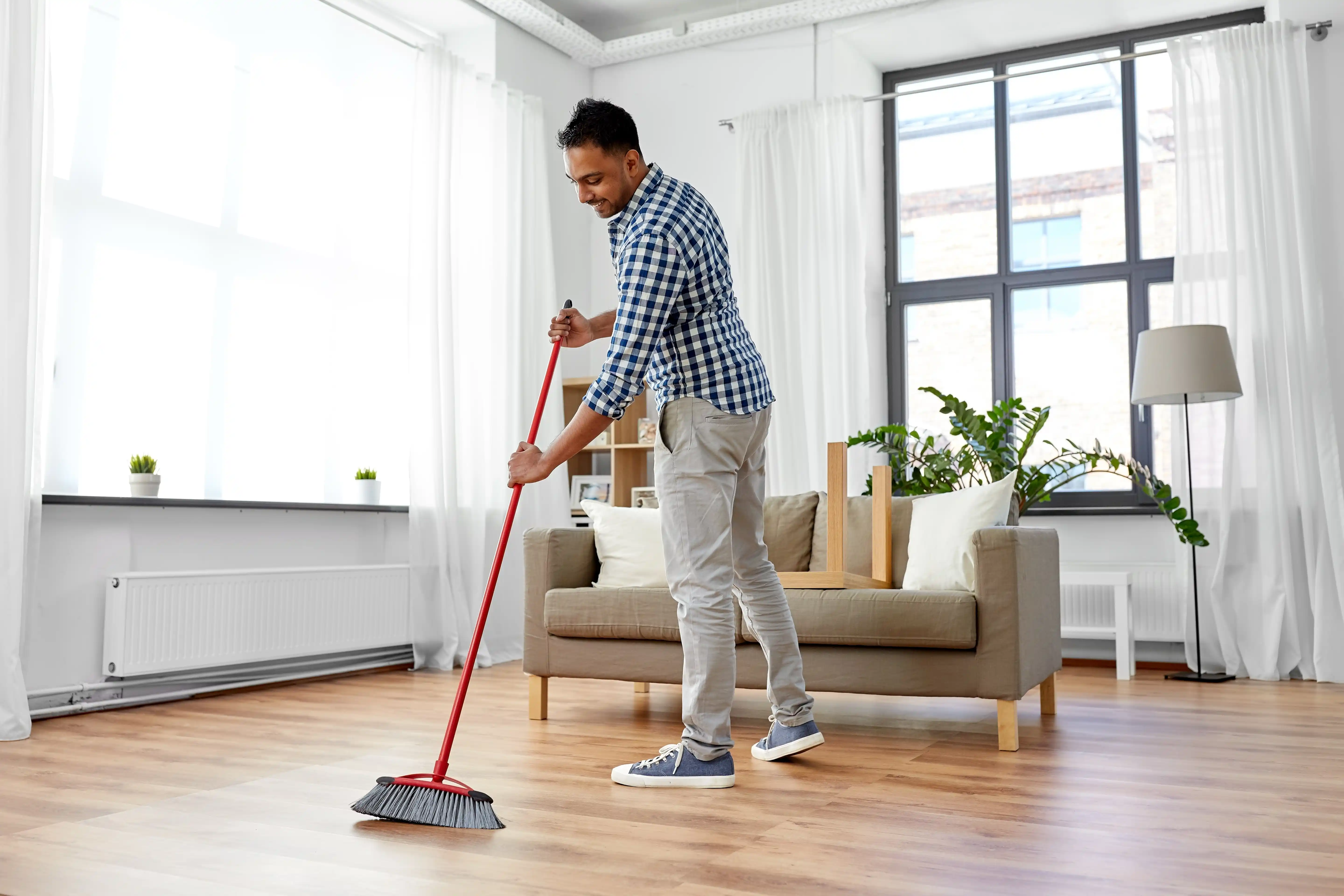 man showing accountability by cleaning the floor in recovery